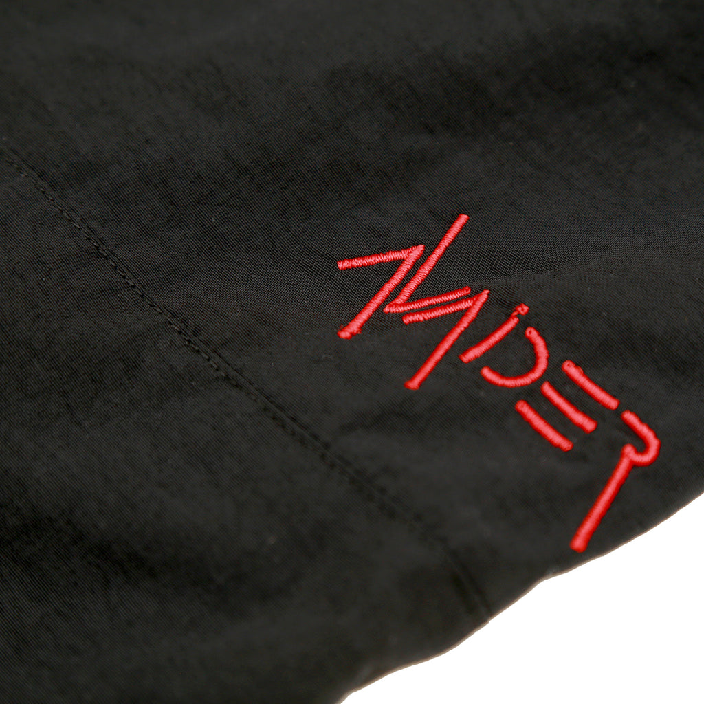 ADELPHI WOVEN TRACK PANT IN BLACK AND  RED