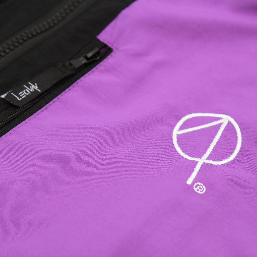 QUIGLEY WINDRUNNER JACKET IN BLACK PURPLE AND NEON